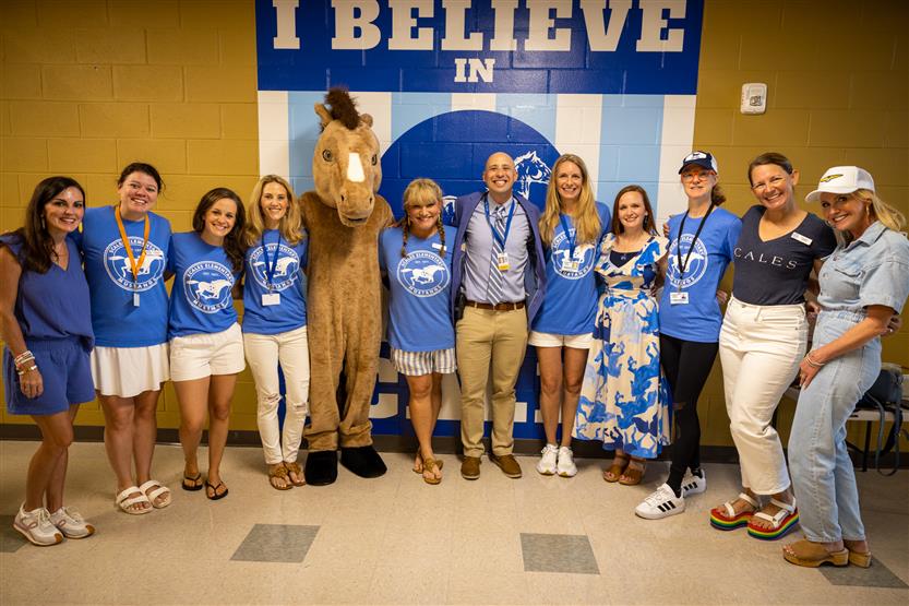 Scales Elementary staff, volunteers and administrators smile